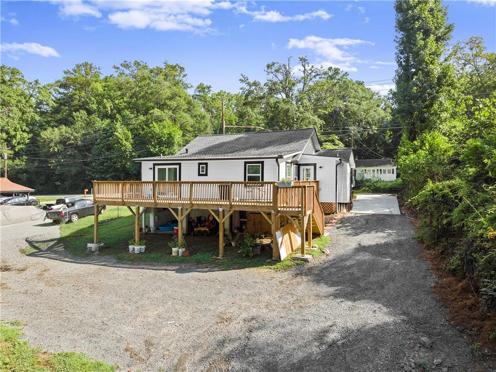 5626 Austell Powder Springs Road Southwest Austell, GA 30106 - Photo 13 of 36 a view of a house with a yard and sitting area