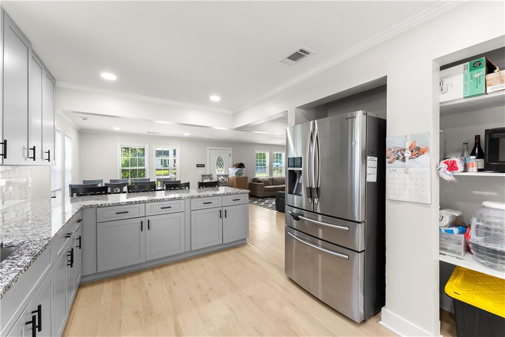 5626 Austell Powder Springs Road Southwest Austell, GA 30106 - Photo 19 of 36 a kitchen with refrigerator and cabinets