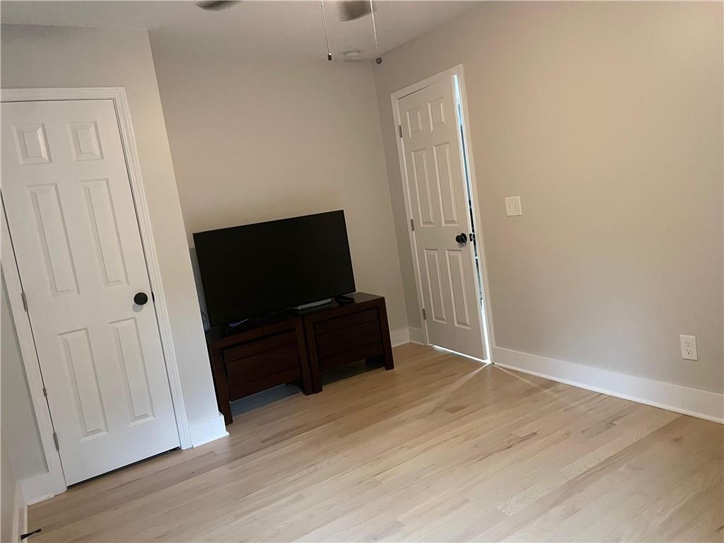 5626 Austell Powder Springs Road Southwest Austell, GA 30106 - Photo 34 of 36 a living room with furniture and a flat screen tv