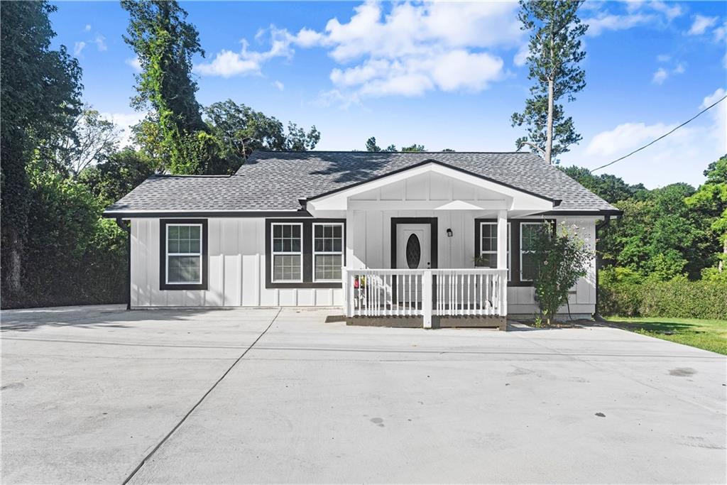 5626 Austell Powder Springs Road Southwest Austell, GA 30106 - Photo 6 of 36 front view of a house with a porch
