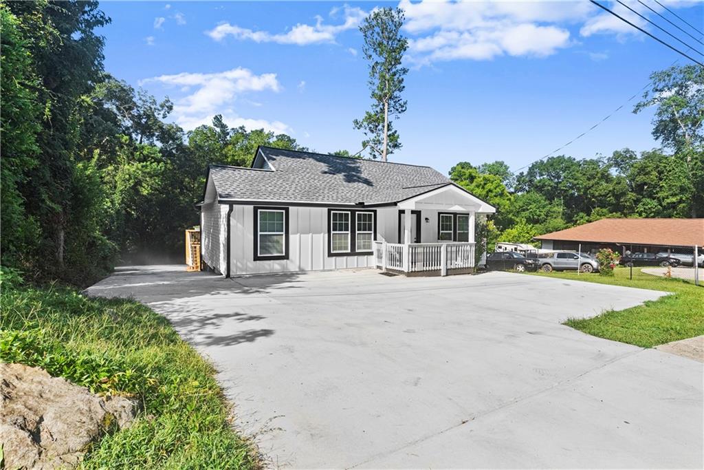 5626 Austell Powder Springs Road Southwest Austell, GA 30106 - Photo 8 of 36 front view of a house with a garden
