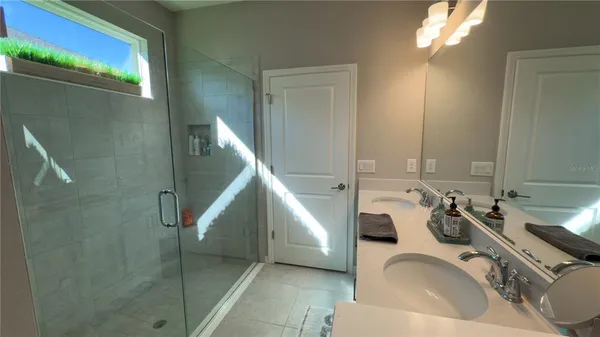 a bathroom with a sink and mirror