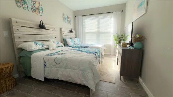 a bedroom with a bed and a window