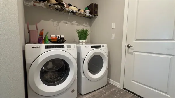 a utility room with dryer and washer
