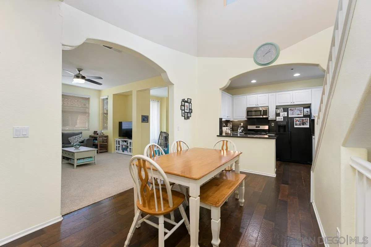4103 Karst Road Carlsbad, CA 92010 - Photo 3 of 16 a view of a dining room with furniture and wooden floor