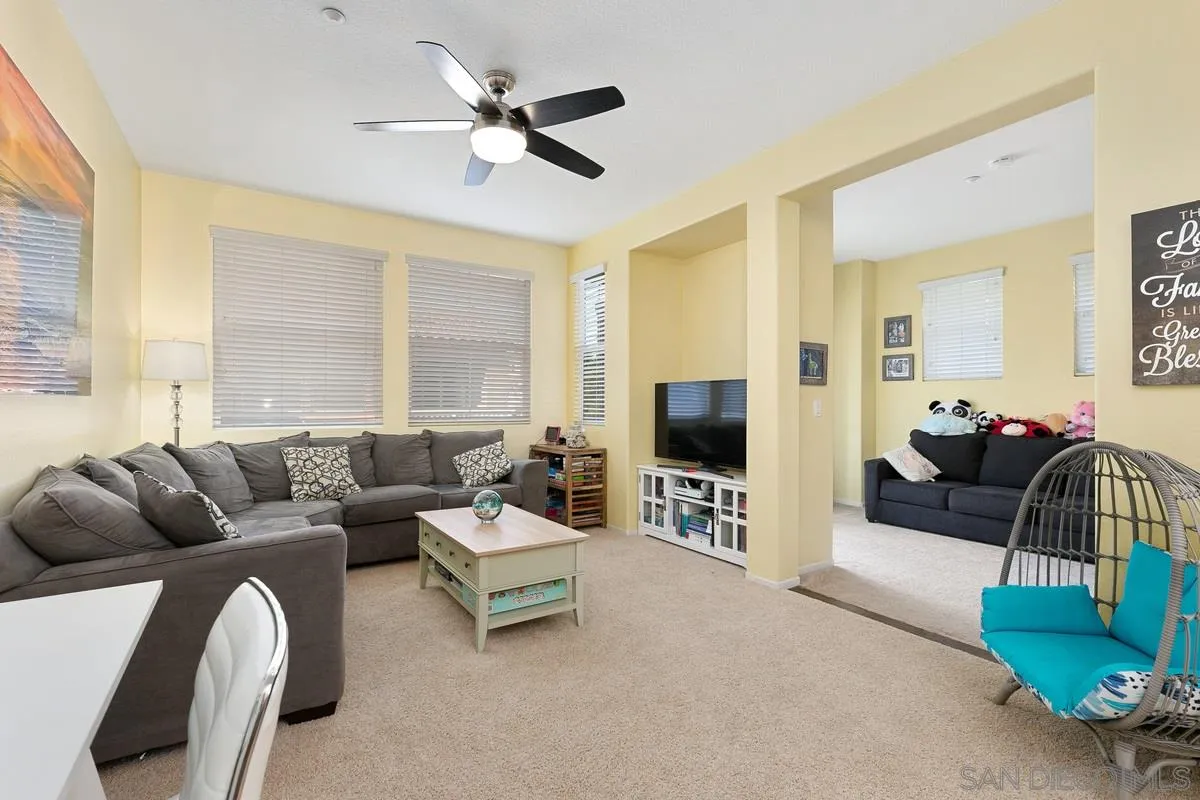 4103 Karst Road Carlsbad, CA 92010 - Photo 5 of 16 a living room with furniture and a flat screen tv
