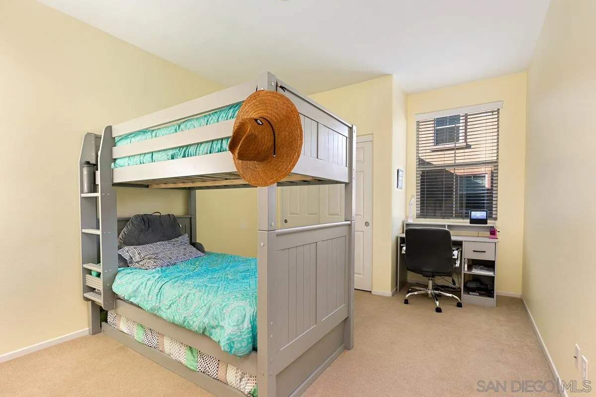 4103 Karst Road Carlsbad, CA 92010 - Photo 8 of 16 a bedroom with a bed and a mirror