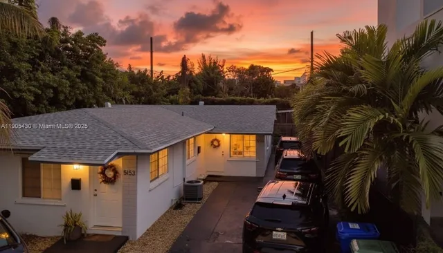a aerial view of a house with a swimming pool