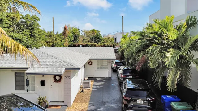 an aerial view of a house with swimming pool