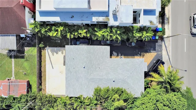 a view of a garden with a building