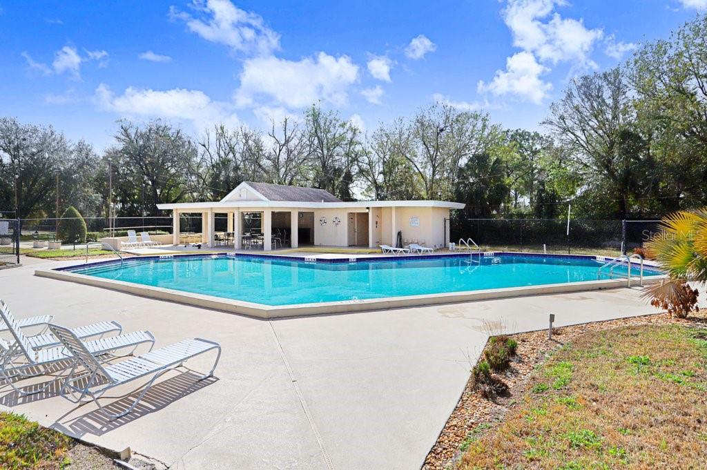 2025 Sylvester Road, Unit C2 Lakeland, FL 33803 - Photo 2 of 28 a view of swimming pool with a yard