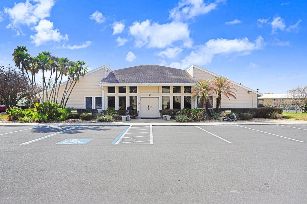 2025 Sylvester Road, Unit C2 Lakeland, FL 33803 - Photo 23 of 28 a front view of a house with a garden