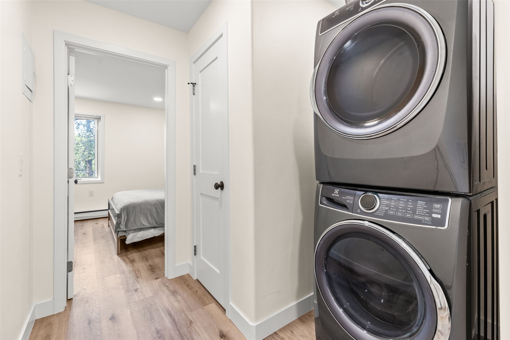 1127 Ski Hill Road, Unit 104 Breckenridge, CO 80424 - Photo 19 of 32 a view of a hallway with washer and dryer