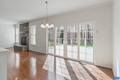 a kitchen with stainless steel appliances granite countertop a stove top oven microwave and refrigerator
