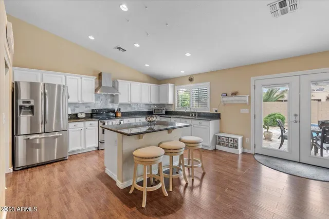 a kitchen with a sink cabinets and window