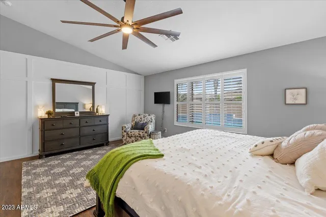 a spacious bathroom with a sink a vanity and a mirror
