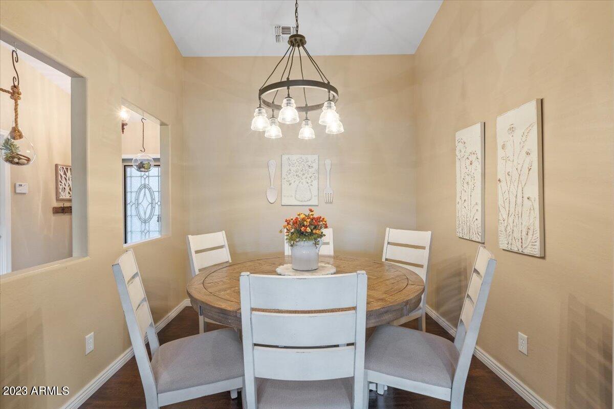 15257 West Hearn Road Surprise, AZ 85379 - Photo 7 of 37 a dining room with furniture and window