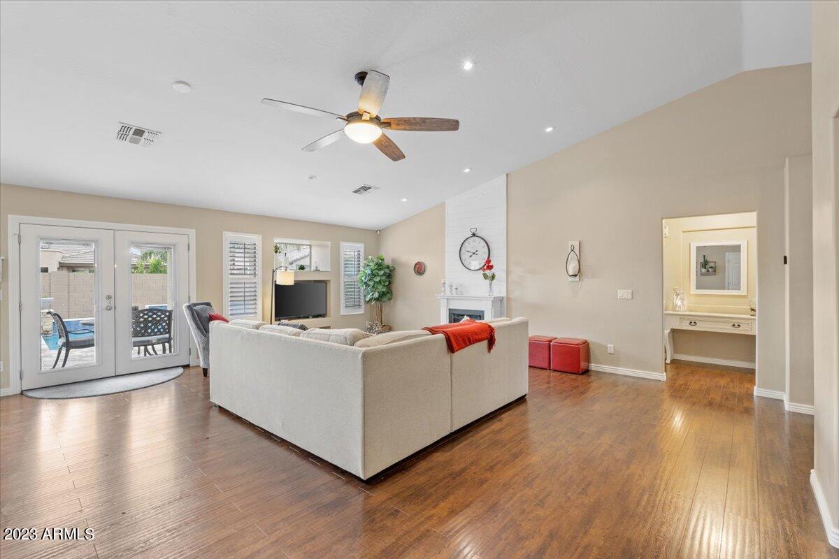 15257 West Hearn Road Surprise, AZ 85379 - Photo 8 of 37 a living room with furniture and a wooden floor