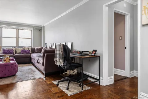 a living room with furniture rug and window
