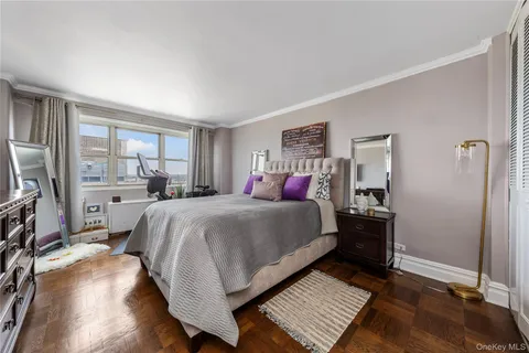 a bed room with a bed and a window