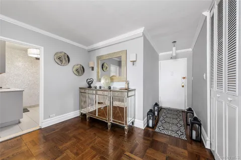 a view of room with window and wooden floor