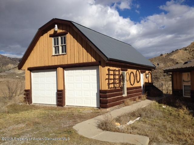 4849 Silt Mesa Road Rifle, CO 81650 - Photo 2 of 12 a front view of a house with a yard