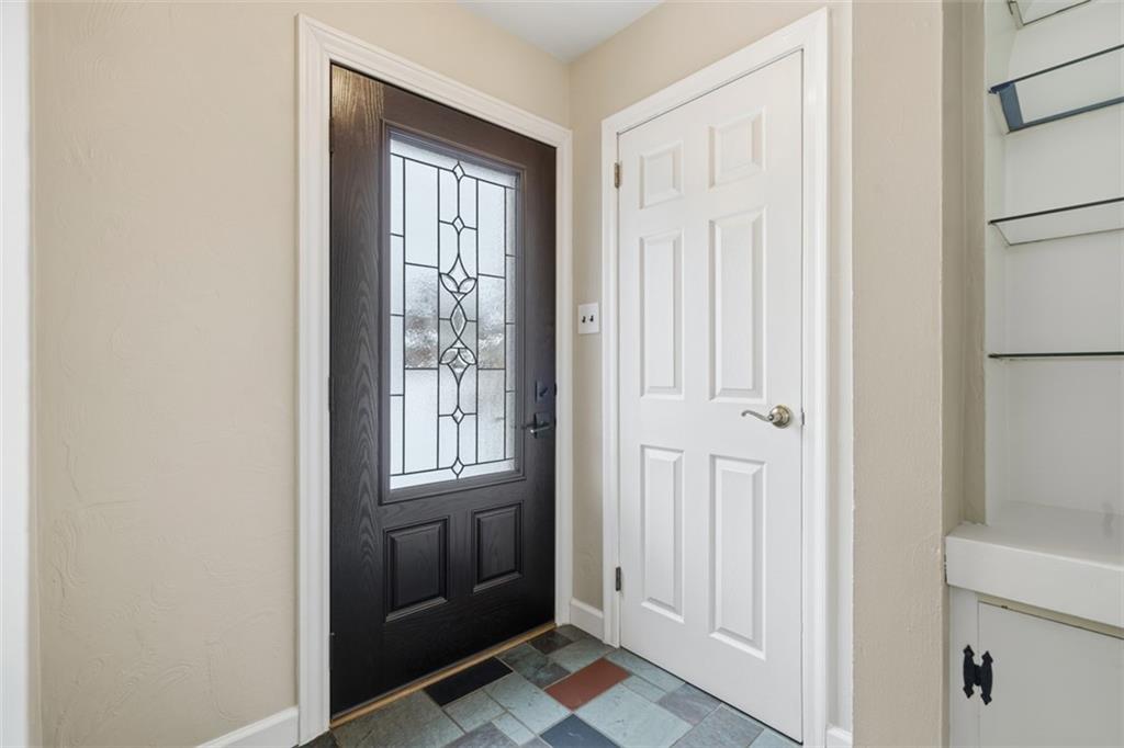 268 Coraopolis Road Coraopolis, PA 15108 - Photo 8 of 50 Front door and main entrance to the home. The flooring was recently replaced and the owners left this square of retro tile flooring as a nod to the rich history of this home, which ads to the character. That door is a coat closet.