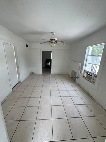 a view of an empty room and window