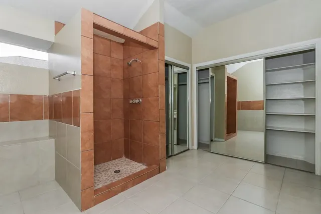 a bathroom with a shower and a sink