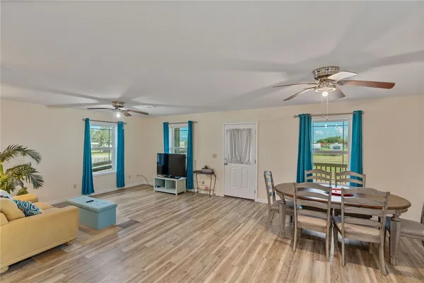 a workspace with furniture window and wooden floor