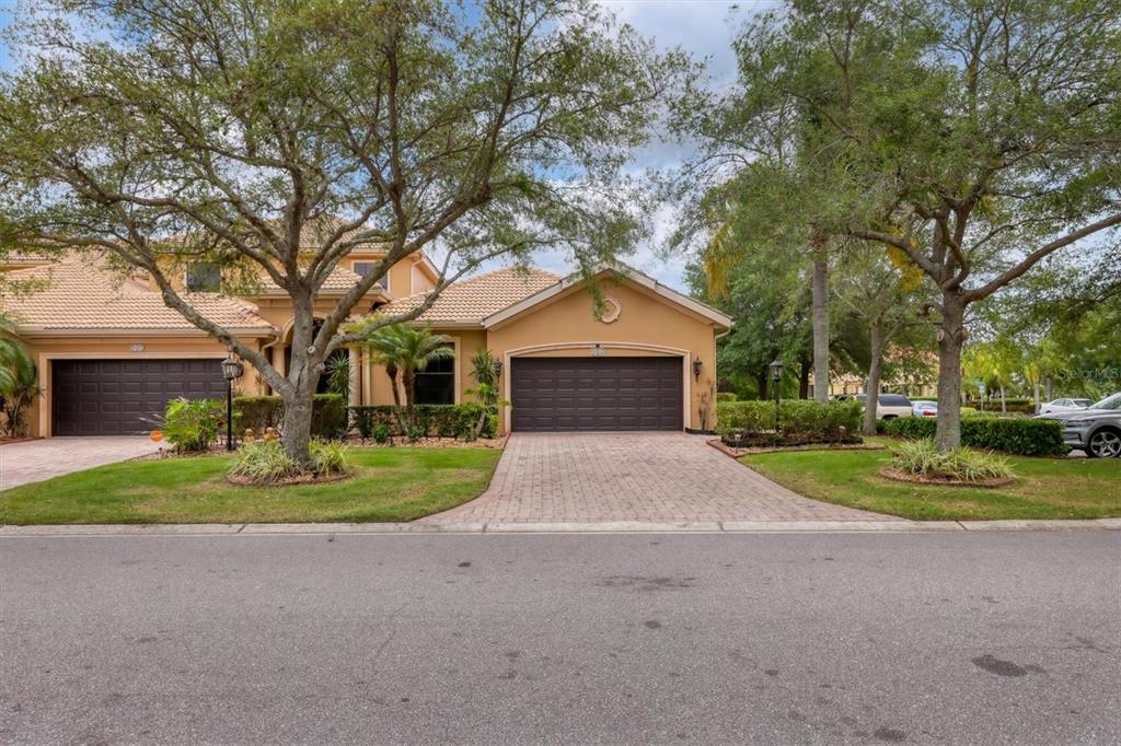 6123 27th Street East Ellenton, FL 34222 - Photo 1 of 1 a front view of a house with a yard and garage