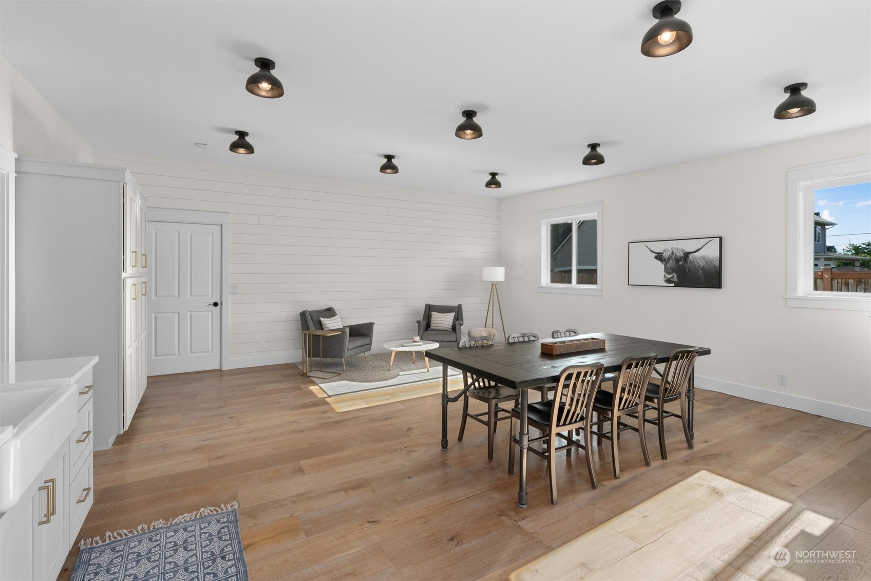 1509 242nd Street Southeast Bothell, WA 98021 - Photo 20 of 40 a view of a dining room with furniture and wooden floor