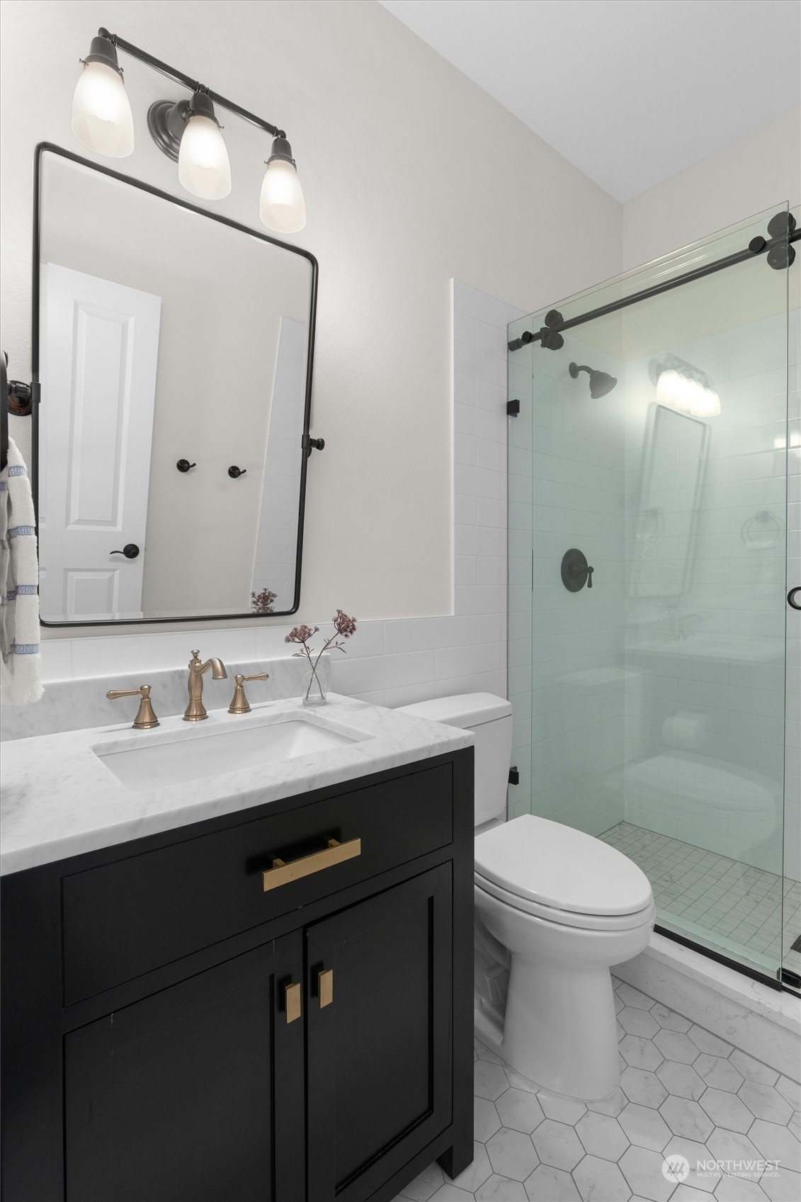 1509 242nd Street Southeast Bothell, WA 98021 - Photo 21 of 40 a bathroom with a sink a toilet and shower