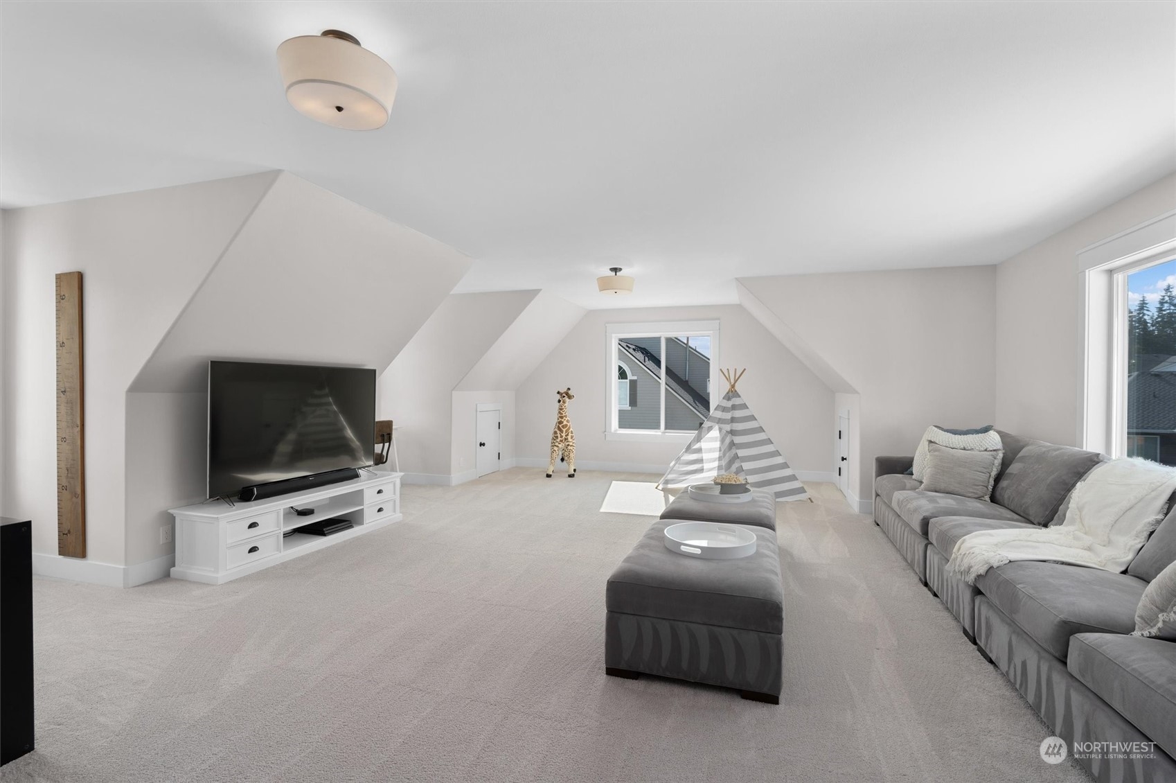 1509 242nd Street Southeast Bothell, WA 98021 - Photo 22 of 40 a living room with furniture and a flat screen tv