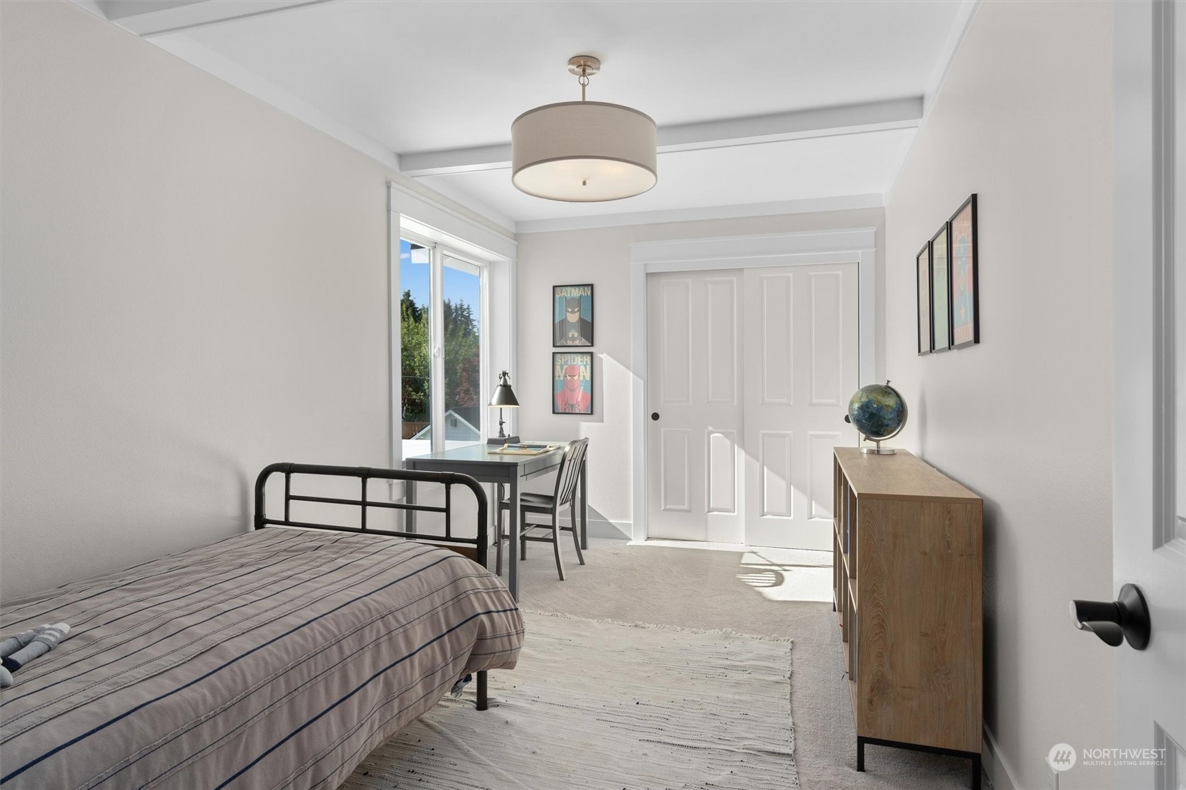 1509 242nd Street Southeast Bothell, WA 98021 - Photo 24 of 40 a bedroom with a bed and a chandelier