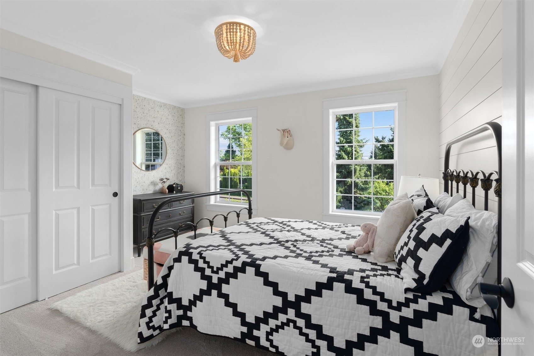 1509 242nd Street Southeast Bothell, WA 98021 - Photo 26 of 40 a bedroom with a bed and wooden floor
