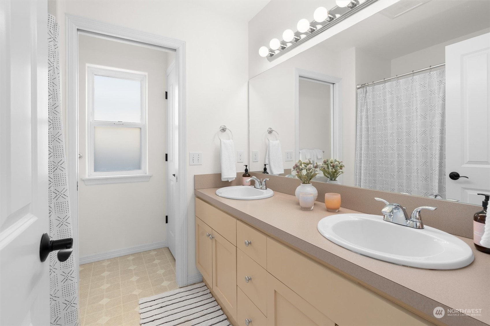 1509 242nd Street Southeast Bothell, WA 98021 - Photo 27 of 40 a bathroom with a double vanity sink and a mirror