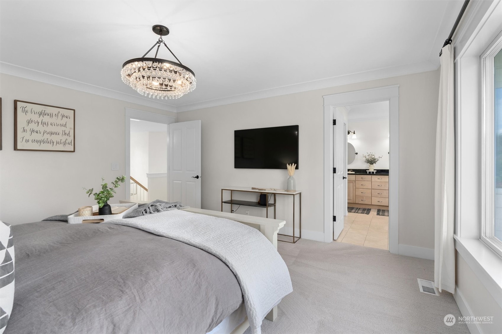 1509 242nd Street Southeast Bothell, WA 98021 - Photo 29 of 40 a bedroom with a bed and a flat screen tv