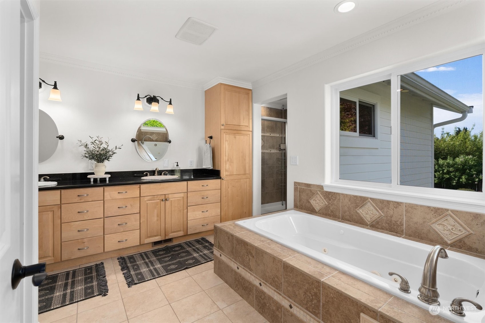1509 242nd Street Southeast Bothell, WA 98021 - Photo 30 of 40 a bathroom with a tub sink and mirror