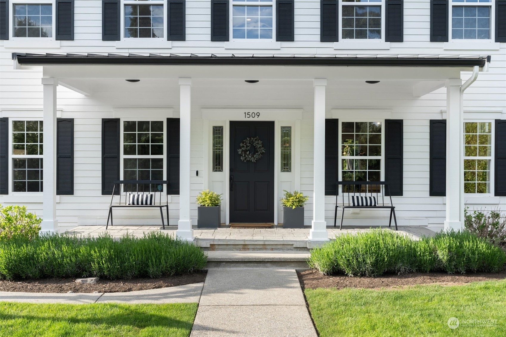 1509 242nd Street Southeast Bothell, WA 98021 - Photo 3 of 40 a front view of a house with a yard