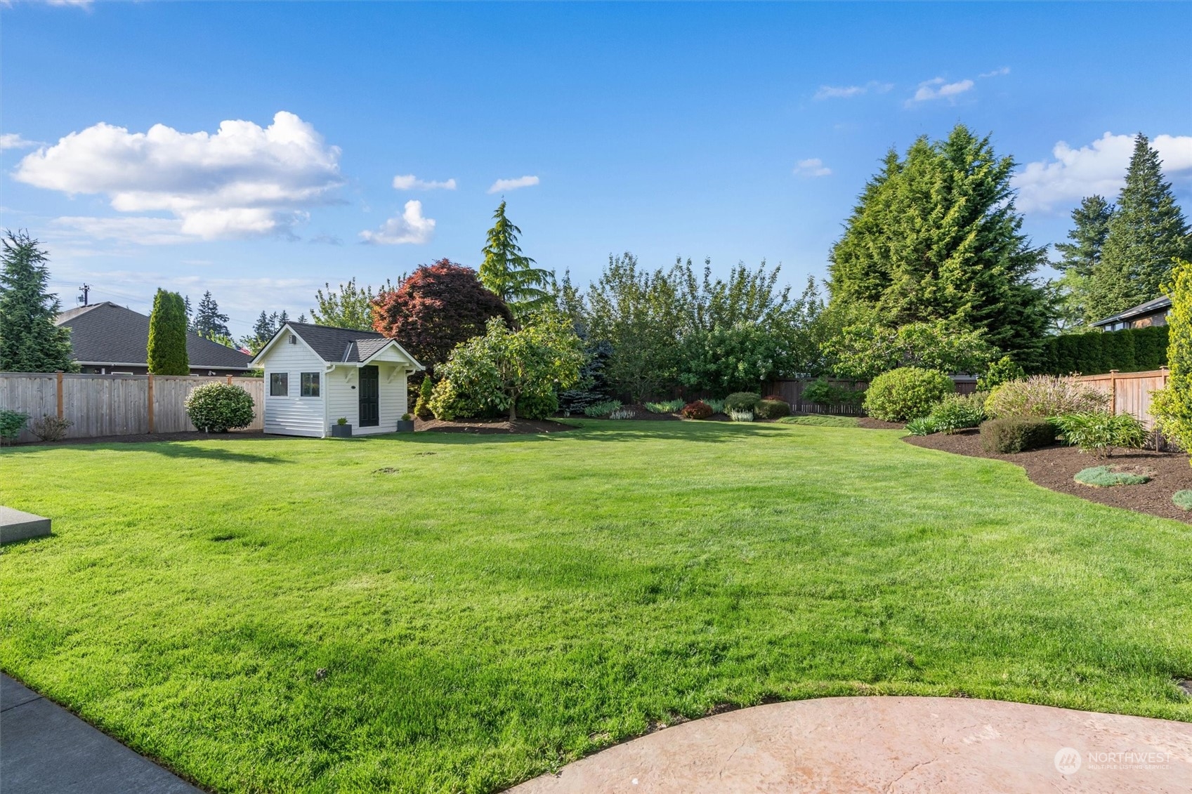 1509 242nd Street Southeast Bothell, WA 98021 - Photo 32 of 40 a view of a house with backyard and garden