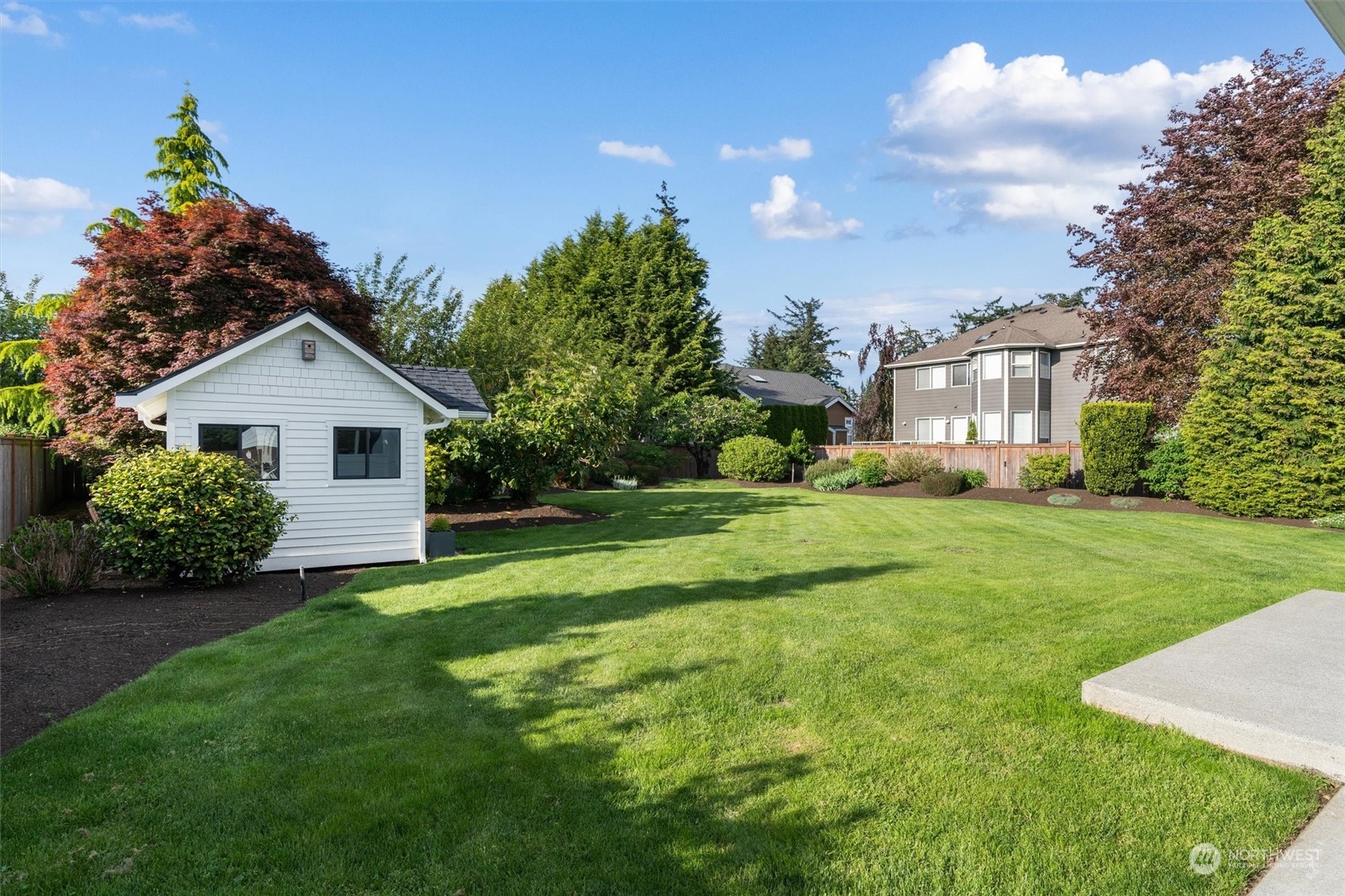 1509 242nd Street Southeast Bothell, WA 98021 - Photo 33 of 40 a front view of a house with a yard and trees