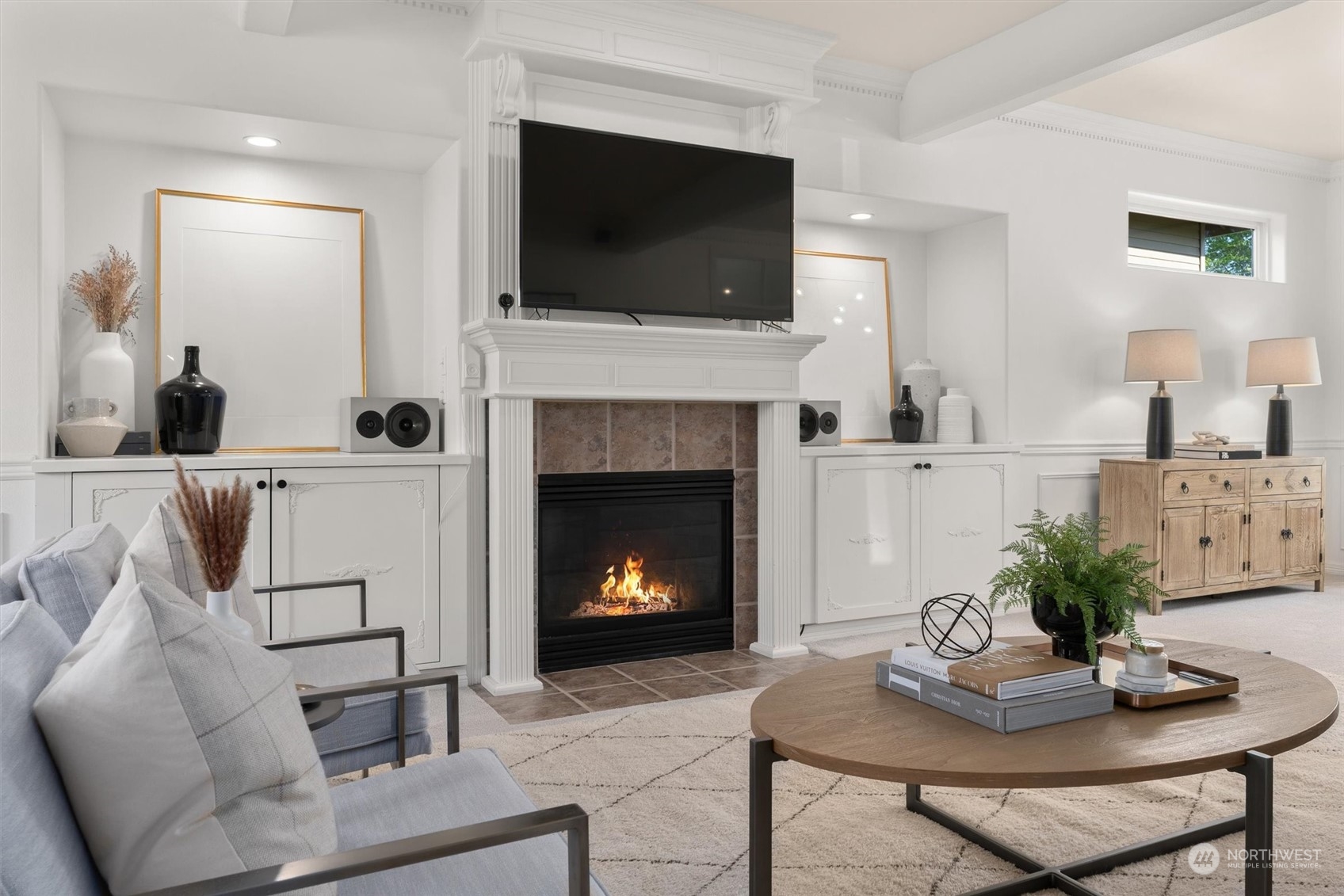1509 242nd Street Southeast Bothell, WA 98021 - Photo 7 of 40 a living room with furniture a fireplace and a flat screen tv