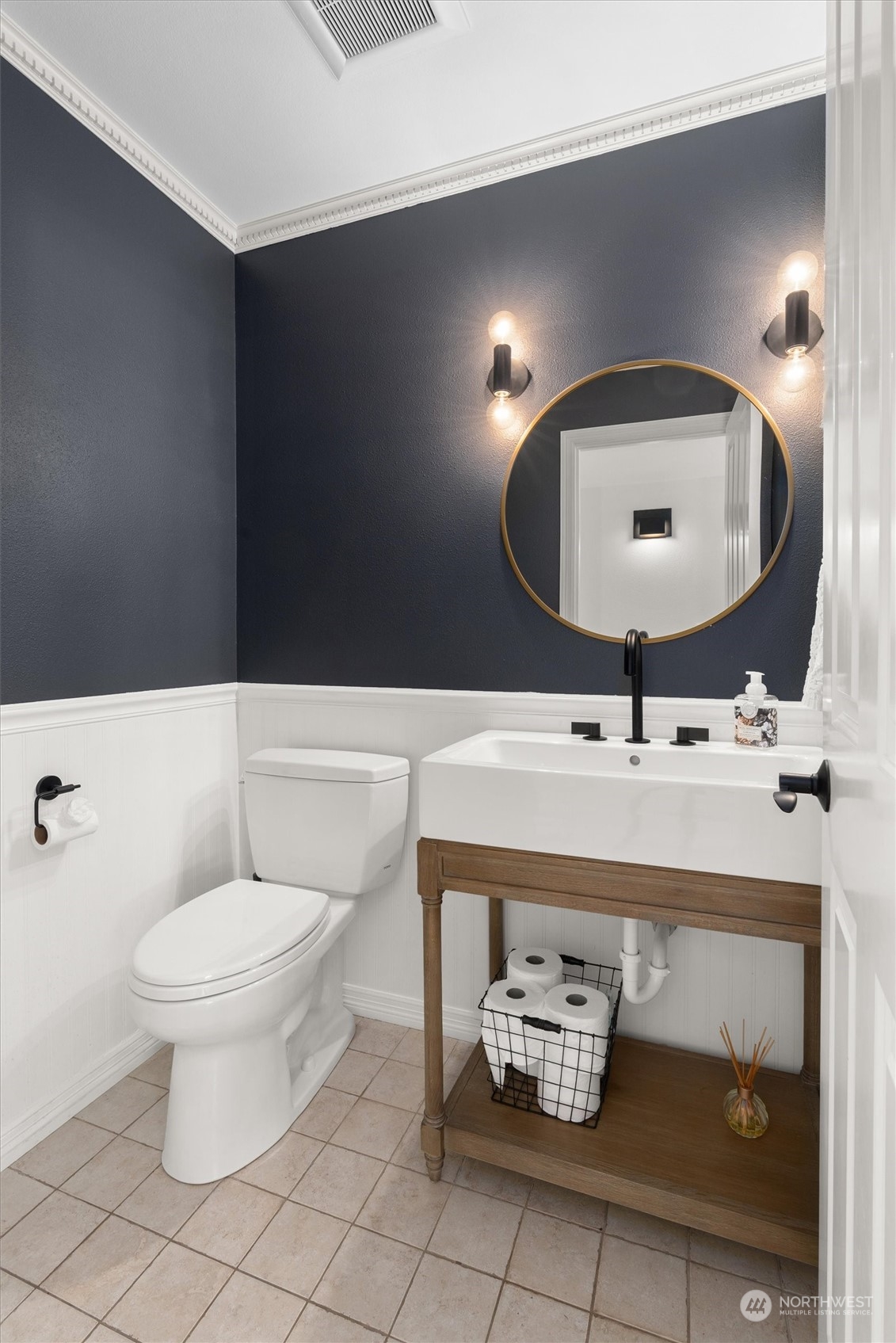 1509 242nd Street Southeast Bothell, WA 98021 - Photo 8 of 40 a bathroom with a toilet sink and mirror