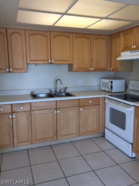 7251 Albany Road Fort Myers, FL 33967 - Photo 21 of 23 a kitchen with white cabinets stainless steel appliances and sink