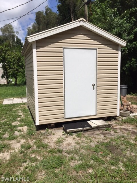 7251 Albany Road Fort Myers, FL 33967 - Photo 8 of 23 a front view of a house with a yard
