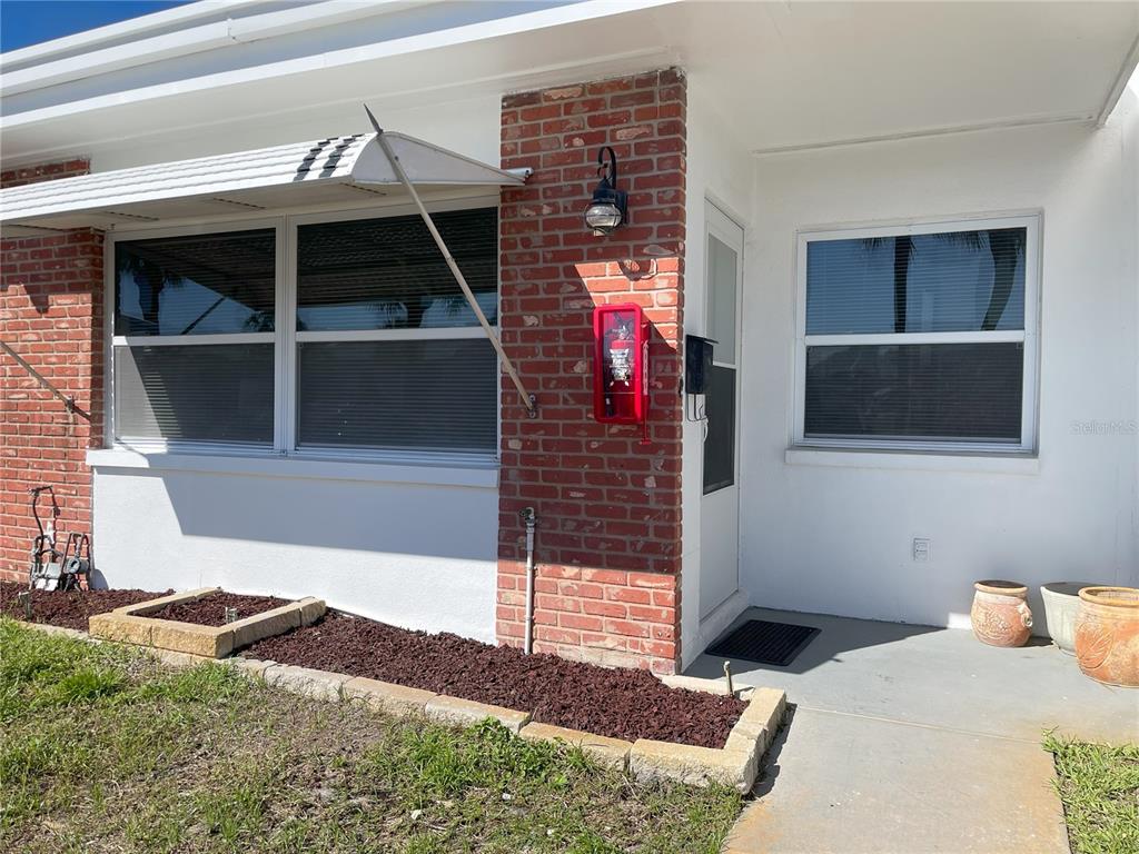 250 Rosery Road Northwest, Unit 329 Largo, FL 33770 - Photo 22 of 27 a bedroom with a bed and a window
