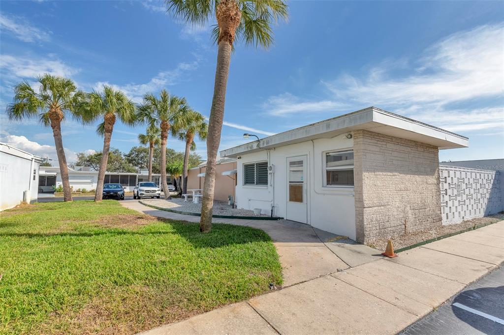 250 Rosery Road Northwest, Unit 329 Largo, FL 33770 - Photo 23 of 27 a house view with a garden space