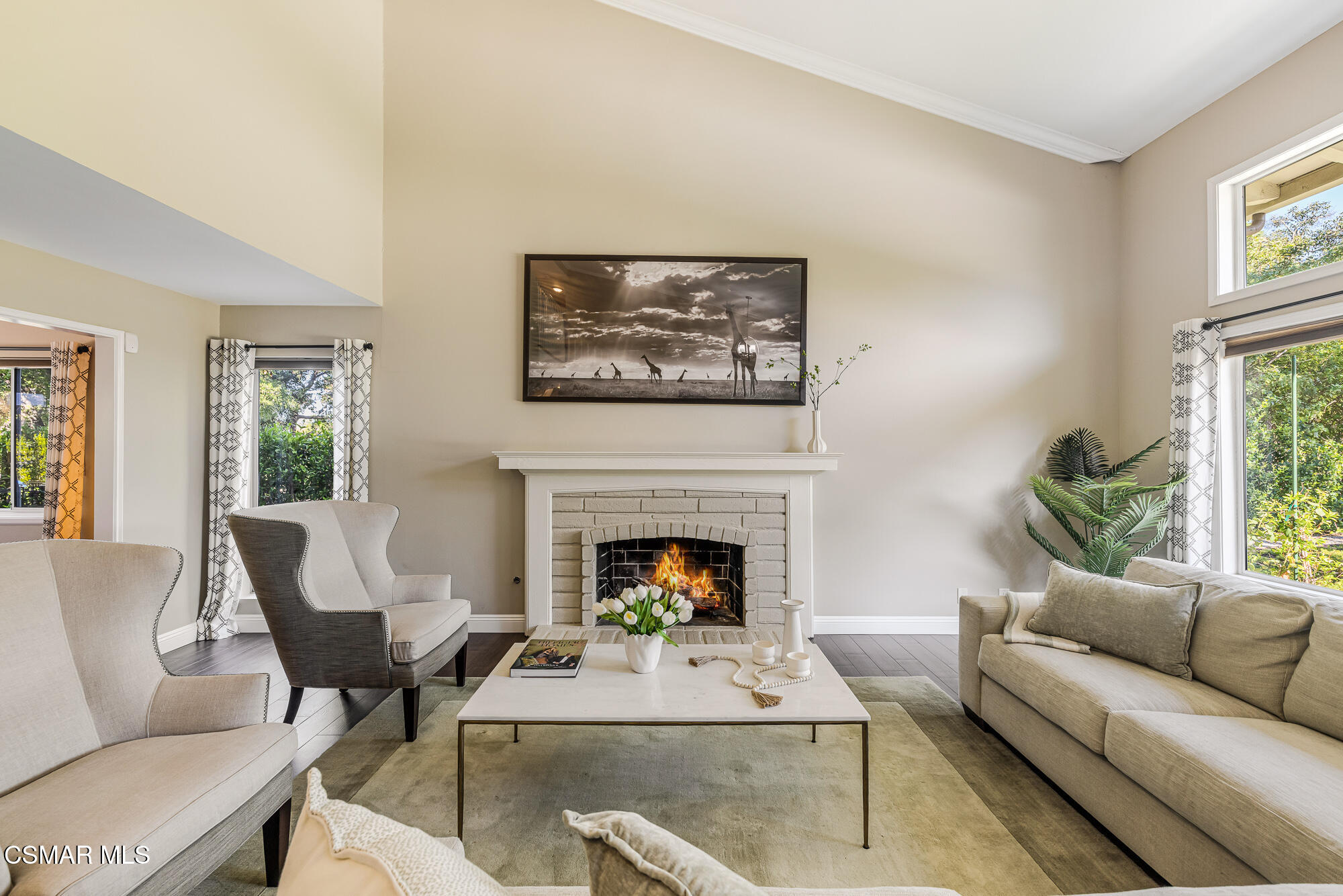 2205 Highgate Road Westlake Village, CA 91361 - Photo 4 of 31 a living room with furniture a fireplace and windows