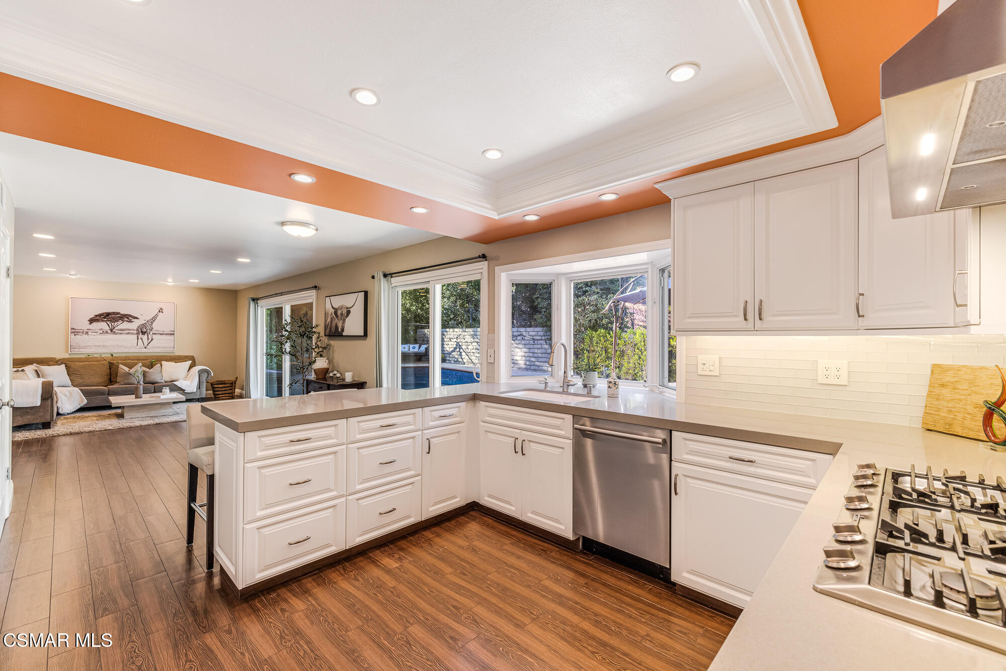 2205 Highgate Road Westlake Village, CA 91361 - Photo 9 of 31 a kitchen with sink cabinets and living room view
